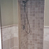 CUSTOM TUMBLED MARBLE SHOWER >